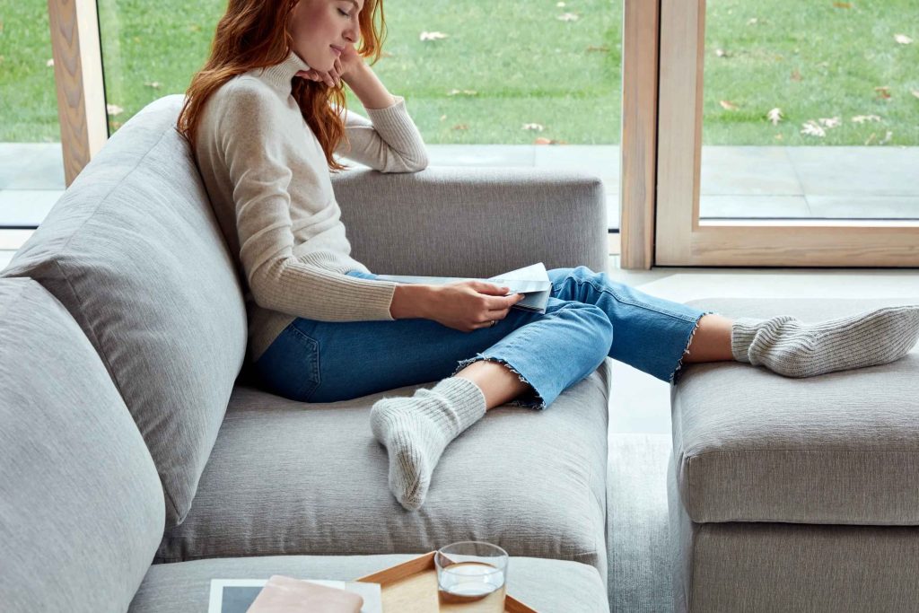 Girl using Ottoman as footrest